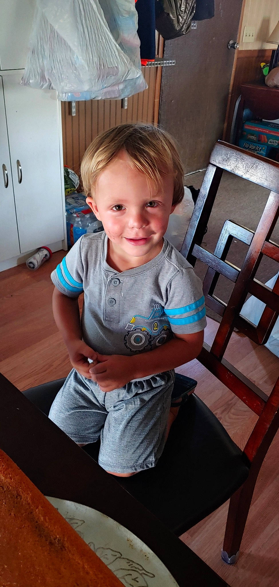 Carter joined the competition — help win amazing prizes! arm, chair, cheek, child, furniture, leg, person, sitting, skin, smile, standing, t_shirt, toddler