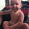 Adeline is registered to the contest to win money with this photo: baby, infant, child, sitting, diaper, barefoot, smiling, face, portrait, outdoor, backyard, chair, blanket, plaid, trees, house, natural_light, photography, toes, family_photo