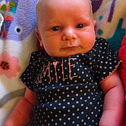 Adeline joined the competition — help win amazing prizes! baby, infant, blanket, animal_print, clothing, polka_dot, face, hand, cute, lying_down, soft_toys, colorful, child, newborn, portrait, indoors, expression, person, smile, fabric