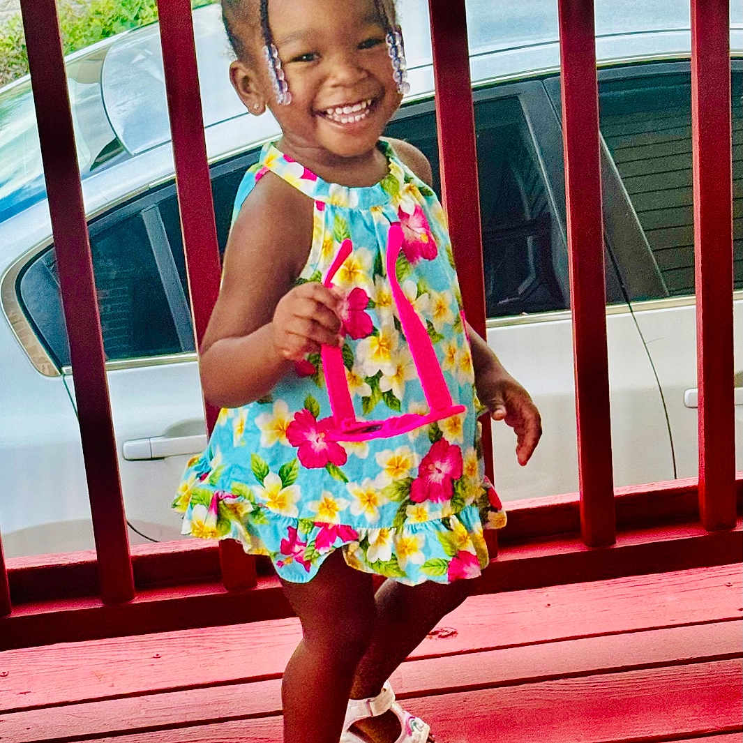 Kenzie is registered to the contest to win money with this photo: architecture, building, child, clothing, dress, face, female, footwear, head, house, housing, person, photography, plant, porch, portrait, pottedplant, sandal, shoe, summer