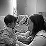 Elyana a rejoint le concours — aidez-le/la à gagner de superbes lots ! baby, child, young_girl, bed, blanket, smile, indoor, family, affection, monochrome, portrait, person, clothing, furniture, window, door, interaction, candid, happy, together