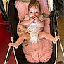 Elyana participe au concours pour gagner de l'argent avec cette photo : baby, infant, stroller, pink_cushion, pacifier, plush_toy, hands, legs, clothing, wooden_floor, baby_girl, cute, indoors, child, person, face, expression, relaxed, comfort, soft_toy