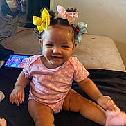 Carmen joined the competition — help win amazing prizes! baby, babylaughing, bed, bedroom, clothing, computer, electronics, face, furniture, happy, head, indoors, person, photography, portrait, room, sitting, sleeve, smile, tabletcomputer