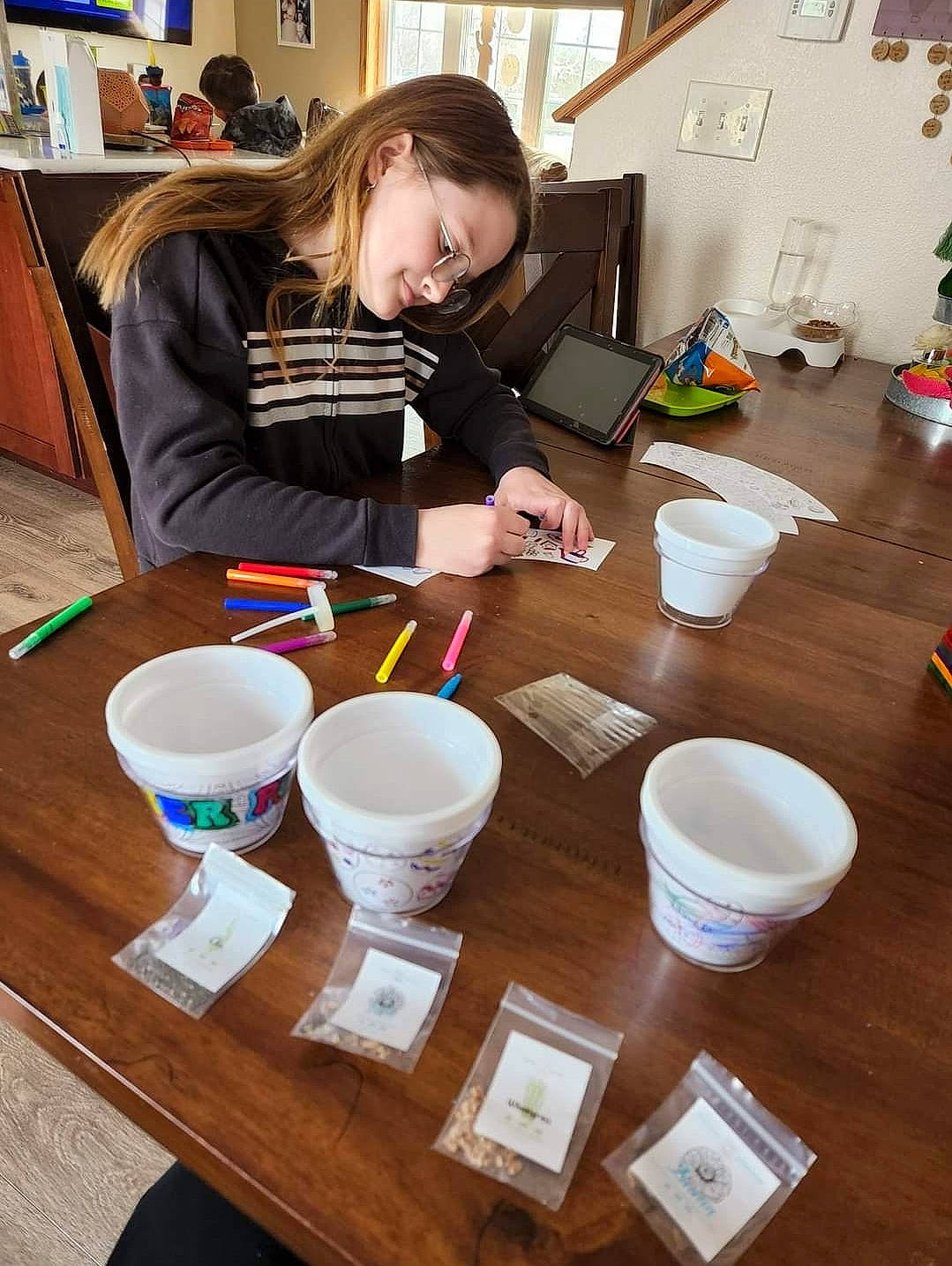 Hailey joined the competition — help win amazing prizes! chair, cooking, cup, dishware, drink, drinkware, flooring, furniture, hardwood, joy, mug, paint, person, picture_frame, porcelain, room, serveware, table, tableware, wood