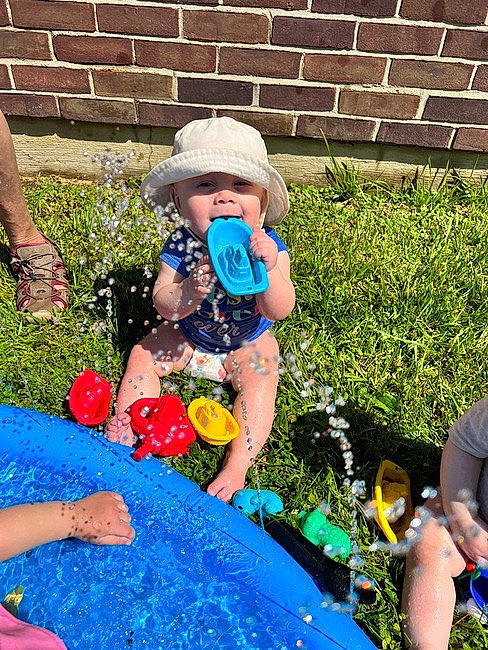 Myllani joined the competition — help win amazing prizes! blue, child, electric_blue, event, fun, garden, grass, happy, headwear, holiday, lawn, leisure, party_supply, people_in_nature, person, personal_protective_equipment, plant, recreation, shorts, sitting
