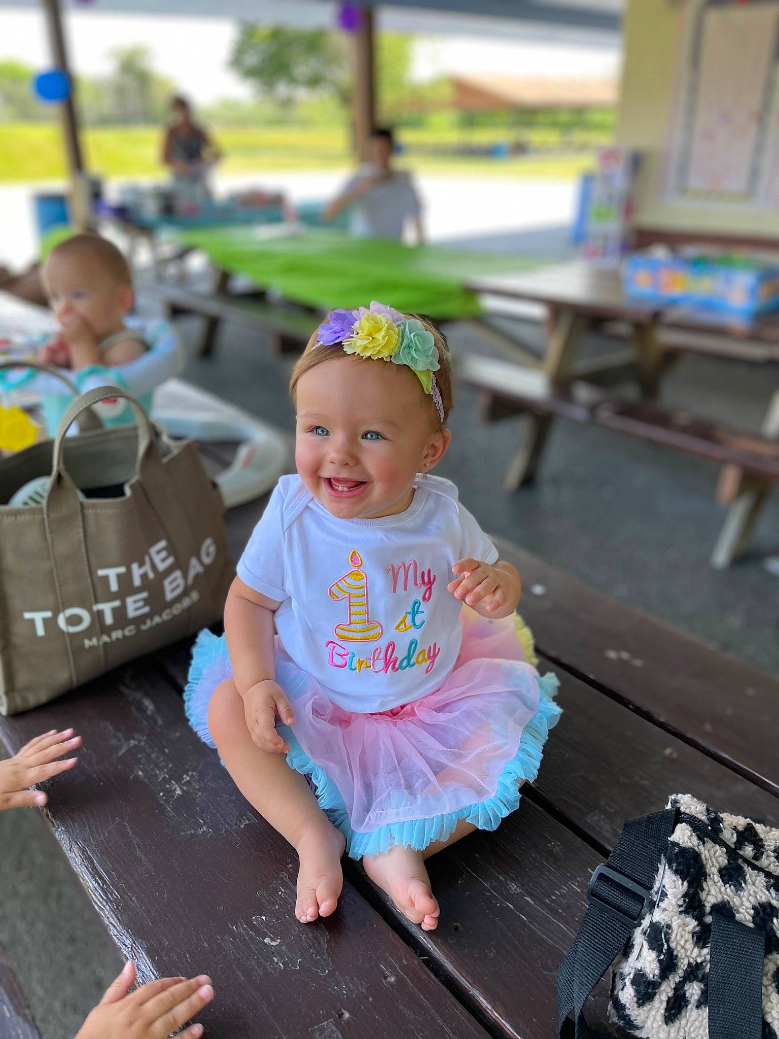 Gemma joined the competition — help win amazing prizes! baby, baby_toddler_clothing, blurred, cap, child, city, event, fun, grass, happy, hat, joy, leisure, person, personal_protective_equipment, play, recreation, sandal, sitting, smile