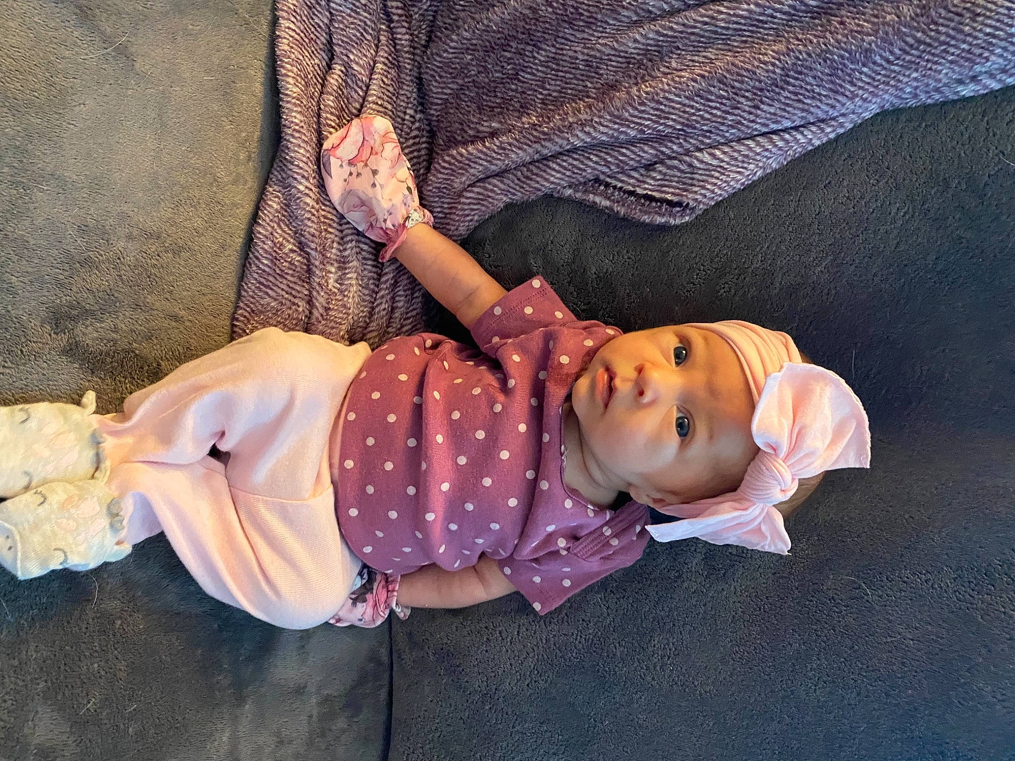 Vivian is registered to the contest to win money with this photo: baby, baby_toddler_clothing, child, costume, doll, fawn, hat, headwear, linens, pattern, person, pink, purple, room, sitting, skin, sleeve, textile, toddler, toy