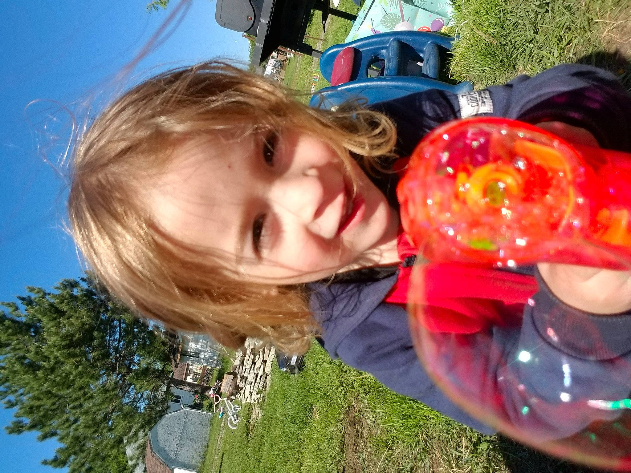 Clarke is registered to the contest to win money with this photo: automotive_lighting, child, event, fun, grass, happy, leisure, light, people_in_nature, person, personal_protective_equipment, plant, play, recreation, sky, smile, summer, toddler, tree, vacation