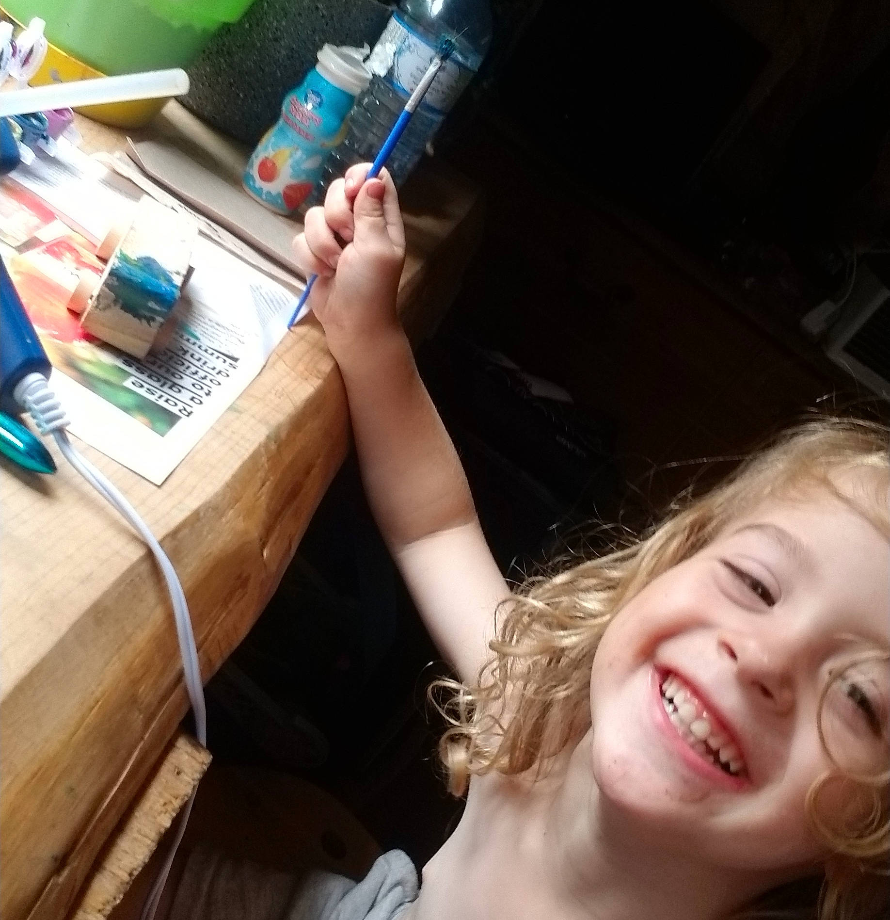 Clarke joined the competition — help win amazing prizes! brown_hair, child, desk, drawer, finger, fun, happy, human_leg, joy, leisure, nail, office_equipment, office_supplies, person, sitting, smile, table, tableware, thigh, thumb