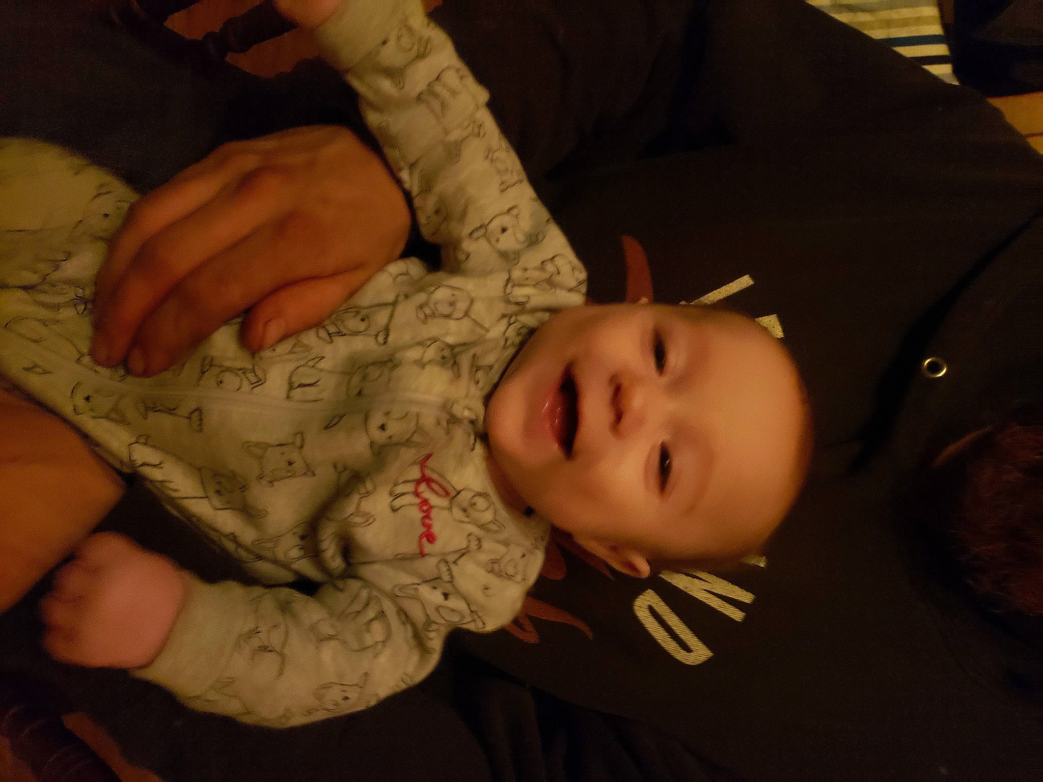 William is registered to the contest to win money with this photo: baby, baby_toddler_clothing, cheek, child, chin, comfort, eyelash, finger, gesture, hand, head, iris, mammal, mouth, nose, person, skin, sleeve, smile, thumb