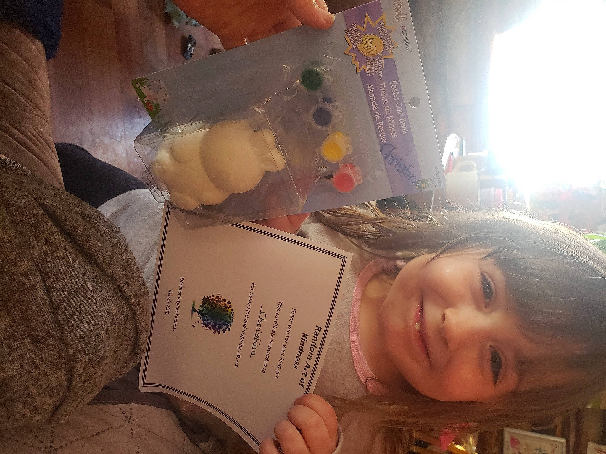 Christina is registered to the contest to win money with this photo: book, child, comfort, comfort_food, food, fun, happy, illustration, joy, person, plant, reading, room, sitting, smile, toddler, tree