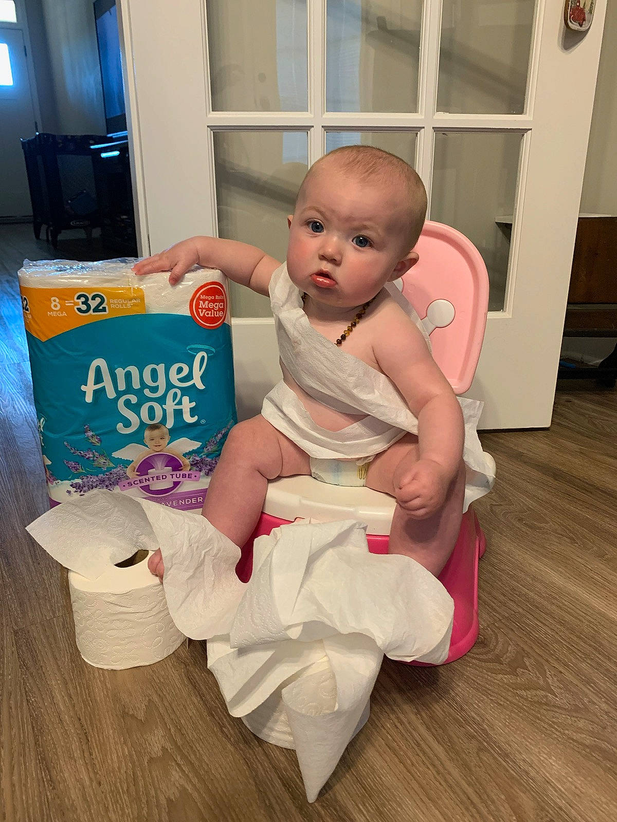 Kimber joined the competition — help win amazing prizes! baby, baby_toddler_clothing, barefoot, child, comfort, diaper, door, floor, flooring, foot, hardwood, human_leg, knee, laminate_flooring, person, room, sock, thigh, toddler, wood