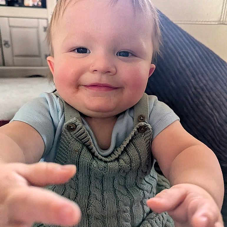 Oakley is registered to the contest to win money with this photo: baby, babylaughing, blonde, bodypart, dimples, face, finger, furniture, hair, hand, happy, head, laughing, person, photoframe, photography, portrait, selfie, sitting, smile