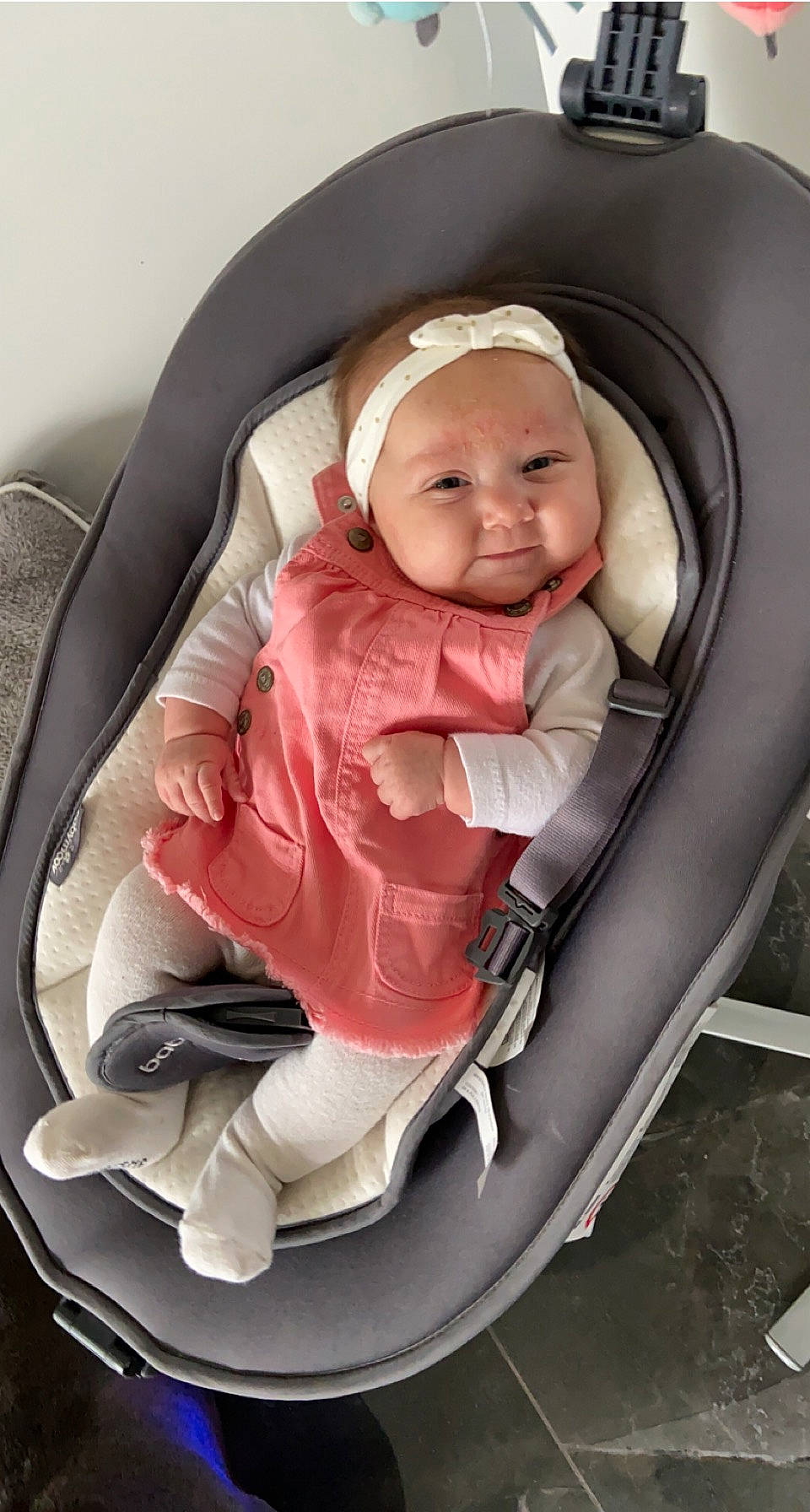 Hilona participe au concours pour gagner de l'argent avec cette photo : auto_part, baby, baby_carriage, baby_in_car_seat, baby_products, baby_toddler_clothing, car_seat, child, comfort, headwear, mouth, person, pink, product, seat_belt, service, sitting, smile, suit, toddler