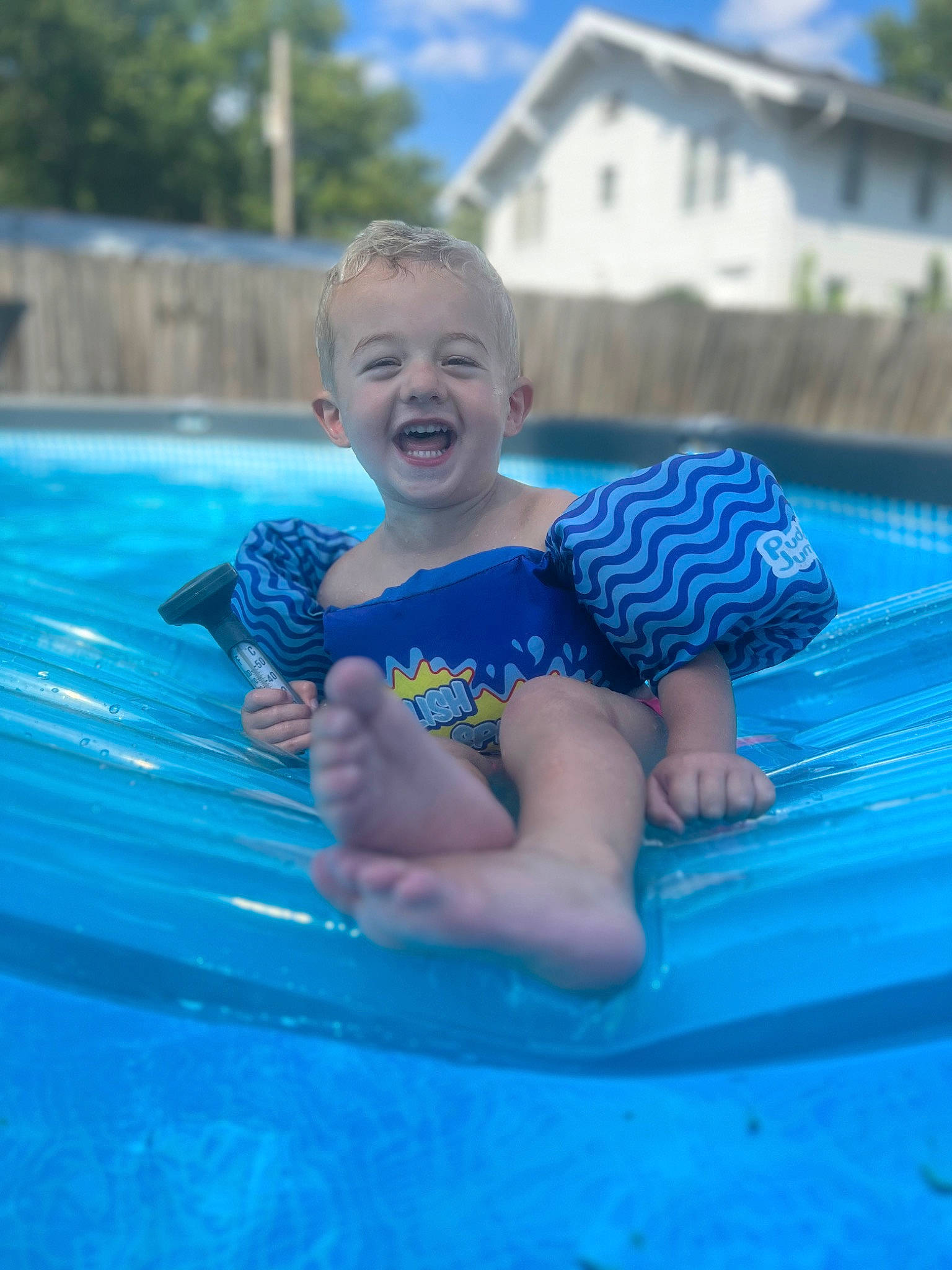 Wrecker is registered to the contest to win money with this photo: aqua, azure, baby, baby_toddler_clothing, bathing, blue, child, electric_blue, fun, happy, leisure, outdoor_recreation, person, recreation, shorts, sky, smile, summer, swimming_pool, toddler