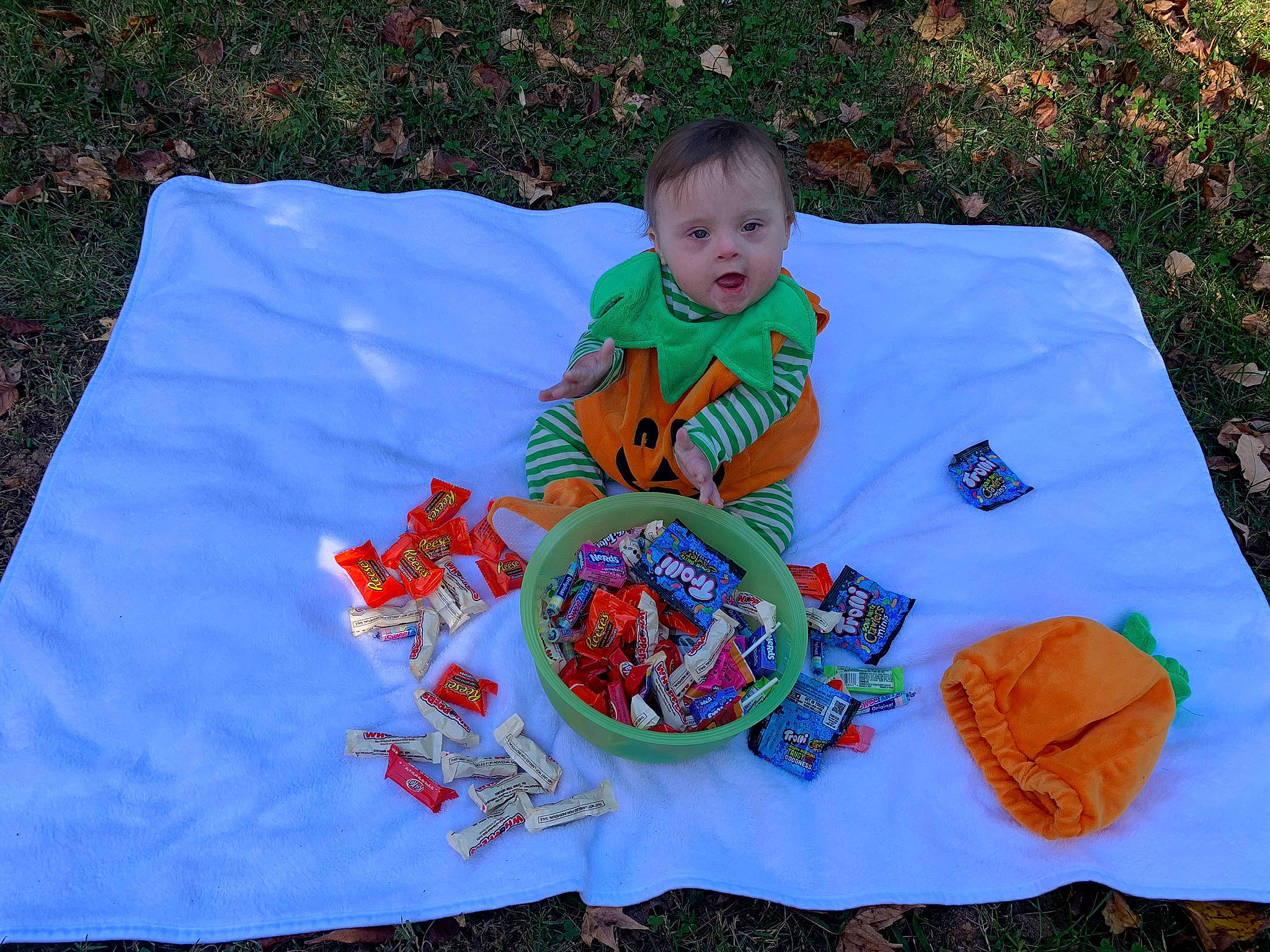 Alyza joined the competition — help win amazing prizes! art, baby, baby_products, baby_toddler_clothing, child, craft, fun, grass, leaf, leisure, linens, orange, pattern, person, play, playmat, product, recreation, smile, surprise