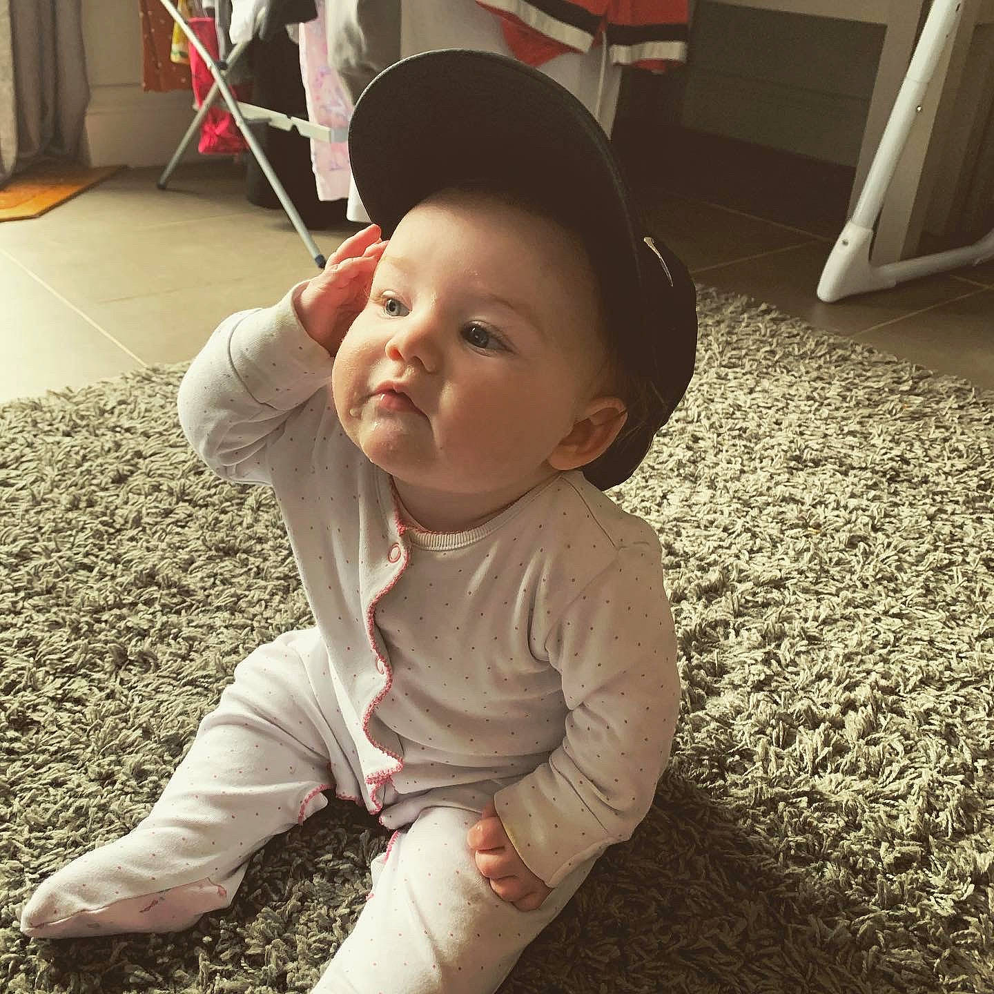 Avah is registered to the contest to win money with this photo: baby, baby_toddler_clothing, cheek, child, clothing, floor, flooring, fun, grass, happy, head, nose, people_in_nature, person, sitting, skin, sleeve, smile, tints_and_shades, toddler