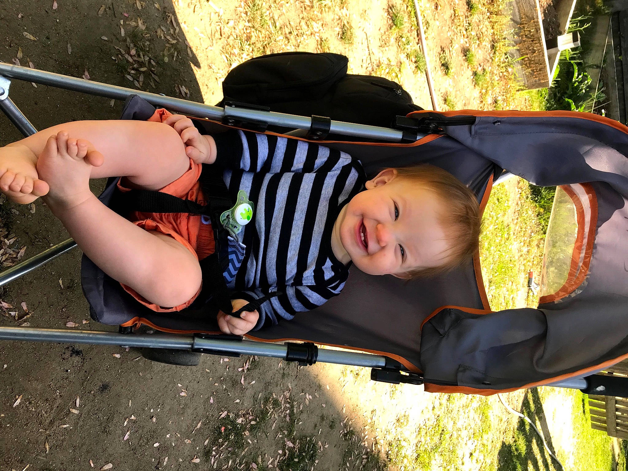 Bentley joined the competition — help win amazing prizes! auto_part, automotive_exterior, baby, baby_carriage, baby_products, baby_toddler_clothing, child, cool, fun, grass, happy, joy, leisure, person, plant, recreation, shorts, sitting, smile, toddler