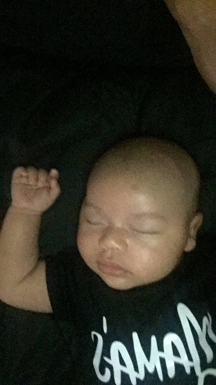 Luciano is registered to the contest to win money with this photo: arm, baby, cheek, child, chin, ear, face, finger, forehead, gesture, hand, head, lip, mouth, neck, nose, person, skin, sleep, thumb