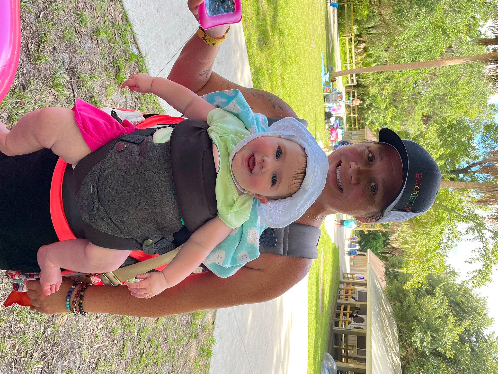 Elizabeth is registered to the contest to win money with this photo: baby, clothing, fun, grass, green, happy, hat, headwear, joy, leisure, people_in_nature, person, photograph, pink, plant, recreation, shorts, smile, summer, sun_hat
