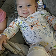 Jaxson joined the competition — help win amazing prizes! baby, blanket, child, closeup, colorful_clothing, comfort, cozy, cute, dog_pattern, face, happy, indoors, infant, lying_down, onesie, playful, portrait, smile, soft_fabric, young