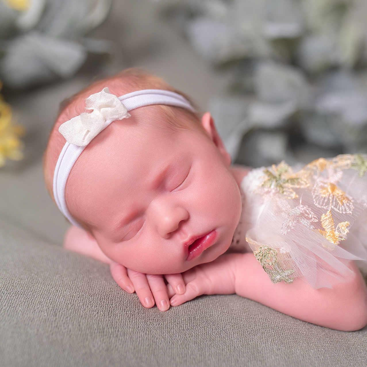 Jozie is registered to the contest to win money with this photo: baby, blurred_background, bow, closeup, cute, delicate, floral_dress, flower, gray, hands, headband, infant, newborn, peaceful, pink_skin, portrait, resting, sleeping, soft_surface, tulle