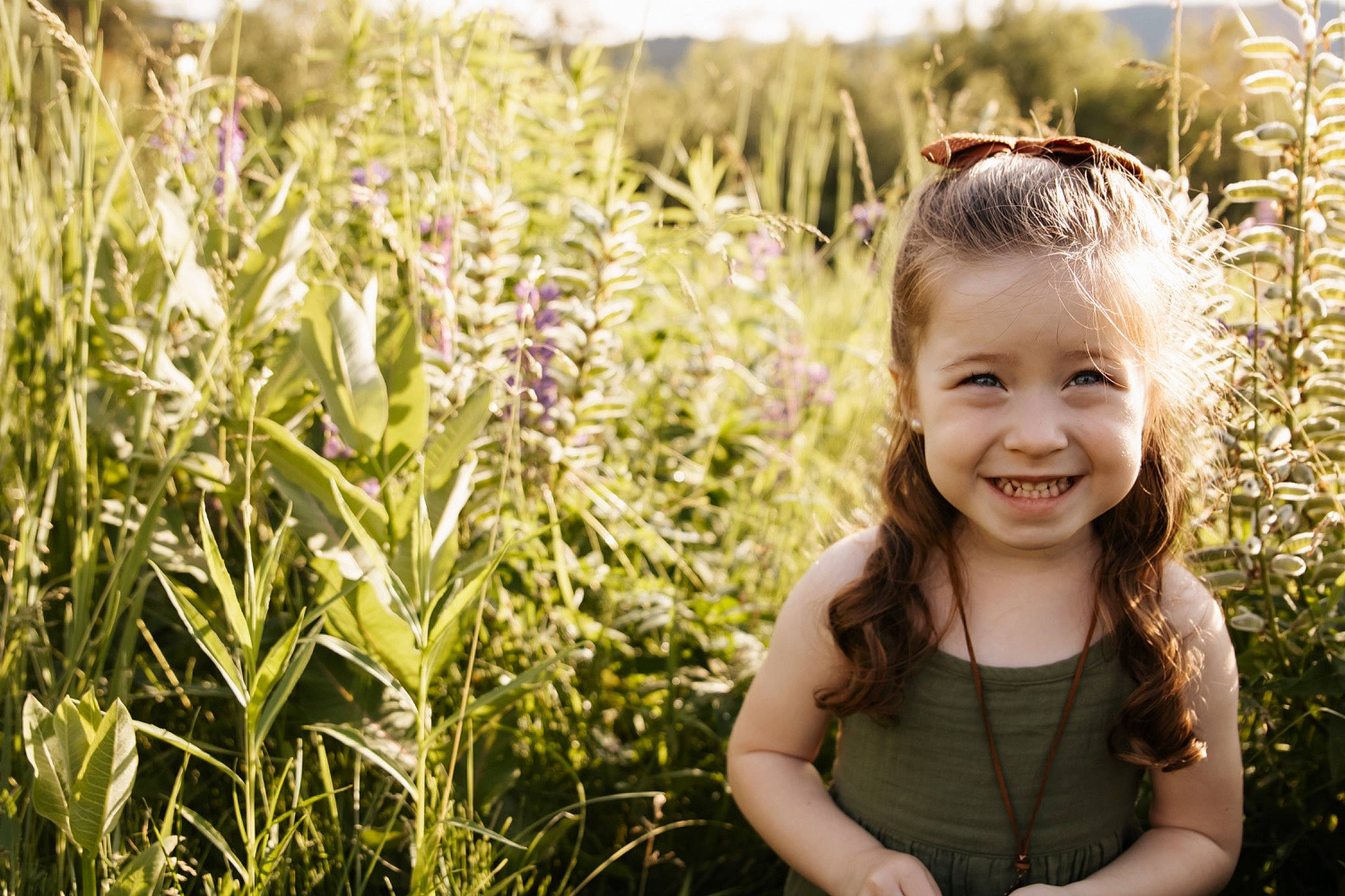 Addison is registered to the contest to win money with this photo: agriculture, baby_laughing, blond, flash_photography, fun, grass, grass_family, grassland, happy, joy, leaf, meadow, people, people_in_nature, person, photograph, plant, prairie, smile, summer