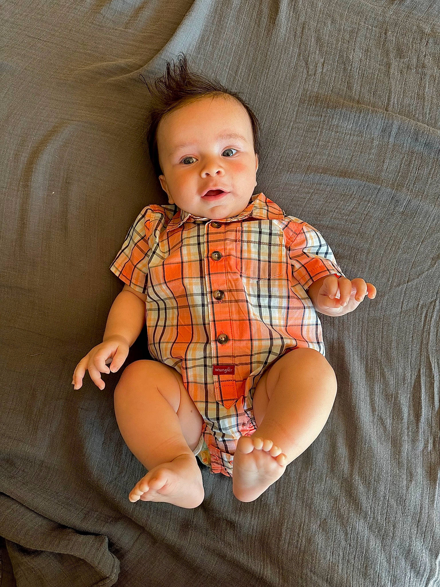 Everett is registered to the contest to win money with this photo: baby, baby_toddler_clothing, barefoot, collar, comfort, eye, finger, flash_photography, head, human_body, iris, knee, orange, person, skin, sleeve, stomach, textile, thigh, toddler