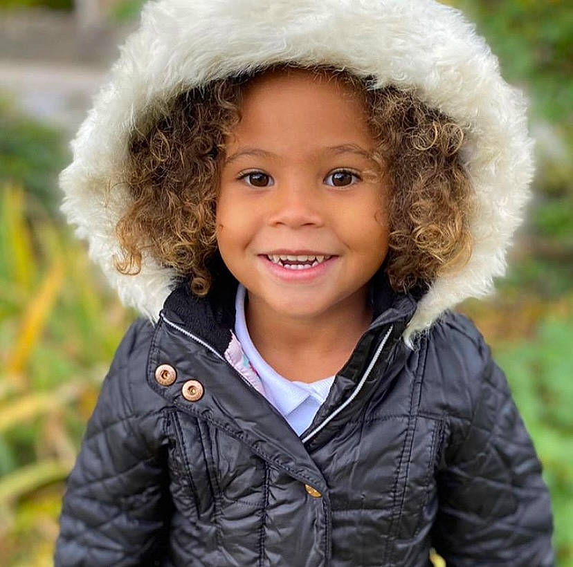 Squishy is registered to the contest to win money with this photo: cheek, child, child_model, clothing, cool, costume_accessory, facial_expression, fur, happy, headgear, iris, jacket, joy, laugh, organ, people_in_nature, person, portrait_photography, skin, sleeve