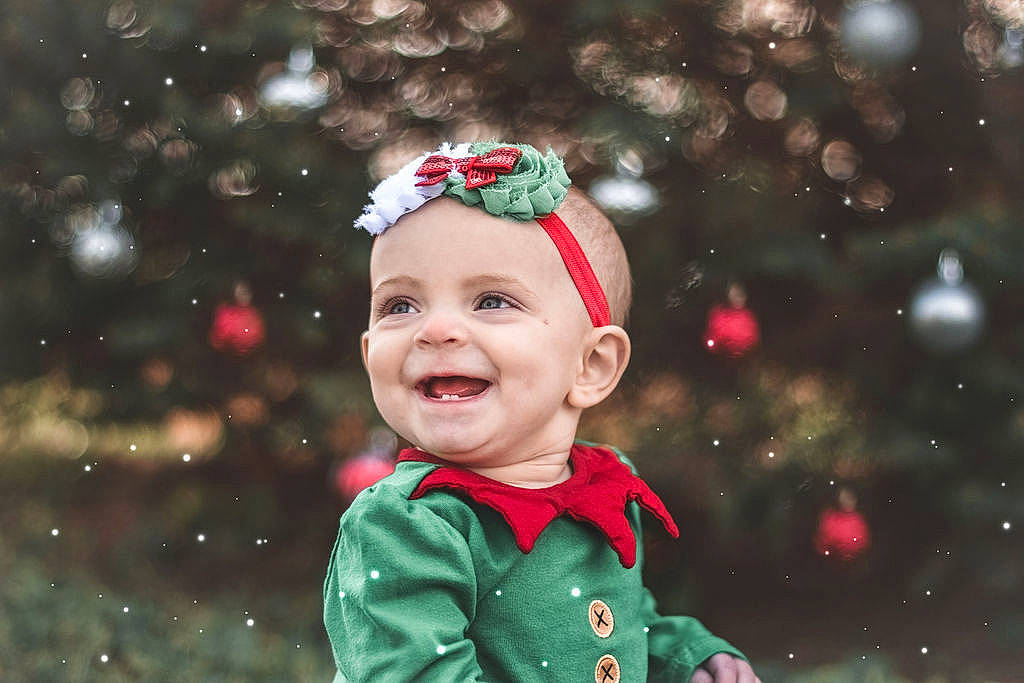 Kyra is registered to the contest to win money with this photo: baby, cheek, child, christmas, christmas_eve, christmas_ornament, facial_expression, fun, happy, head, headgear, joy, person, photograph, photography, portrait, portrait_photography, red, smile, toddler