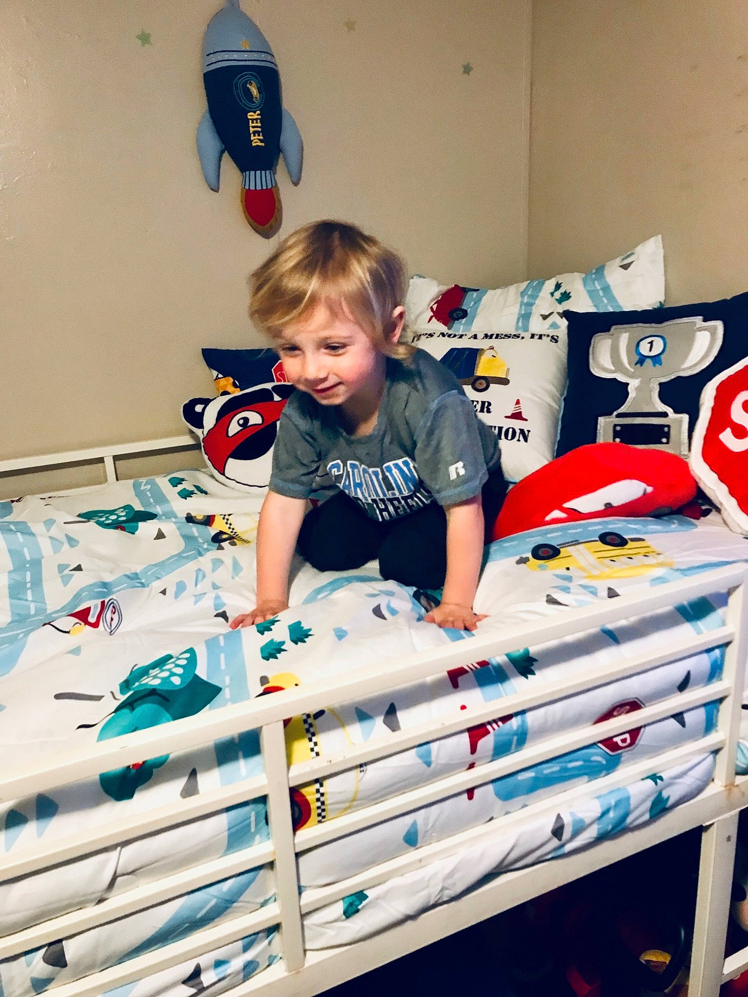 Emmett is registered to the contest to win money with this photo: child, electric_blue, fun, happy, leisure, linens, pattern, person, play, room, shirt, shorts, sitting, sleeve, t_shirt, toddler, toy