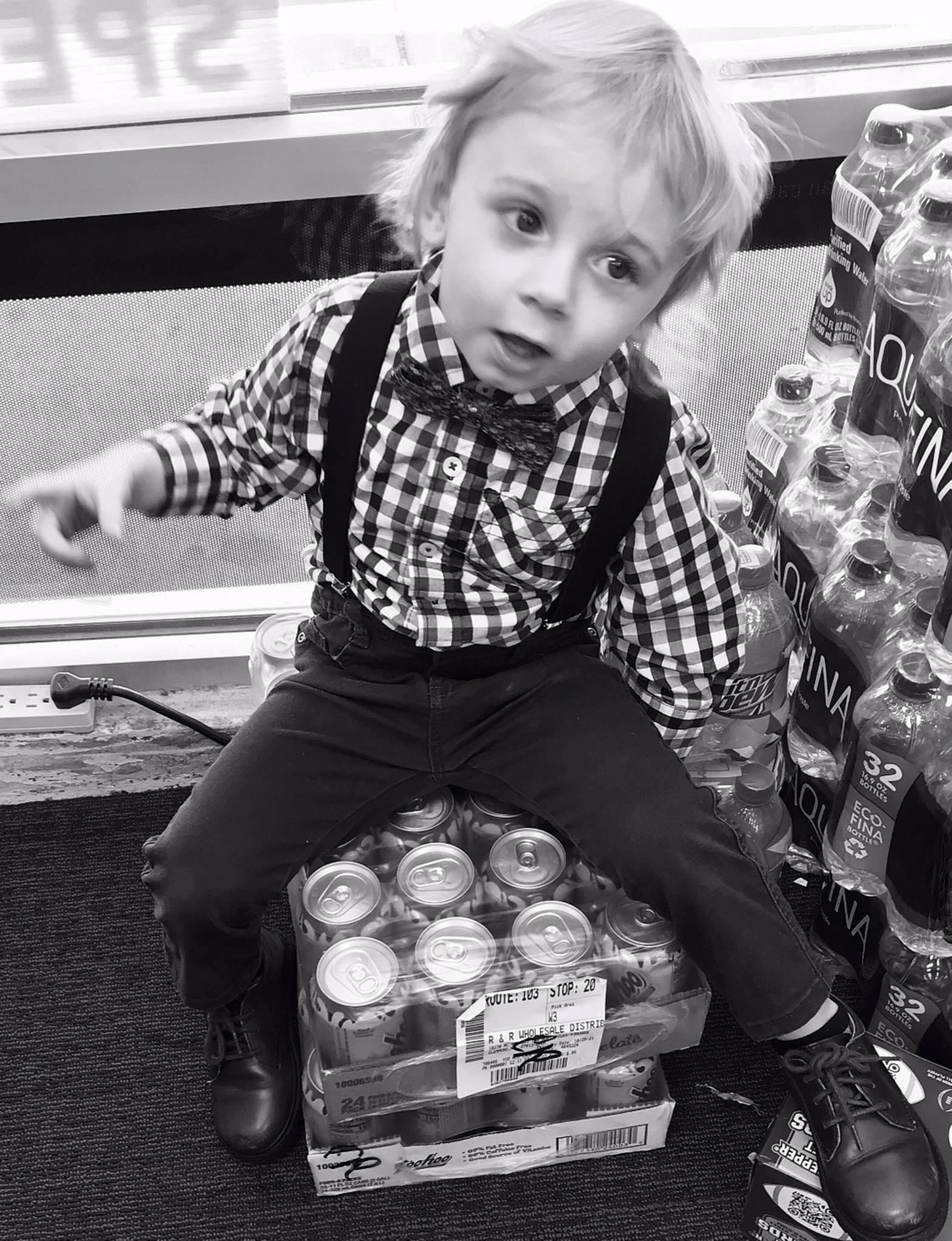 Emmett is registered to the contest to win money with this photo: black, black_and_white, blond, child, fun, happy, human_leg, monochrome, monochrome_photography, pattern, person, photograph, shoe, sitting, snapshot, sneakers, standing, street_fashion, style, toddler