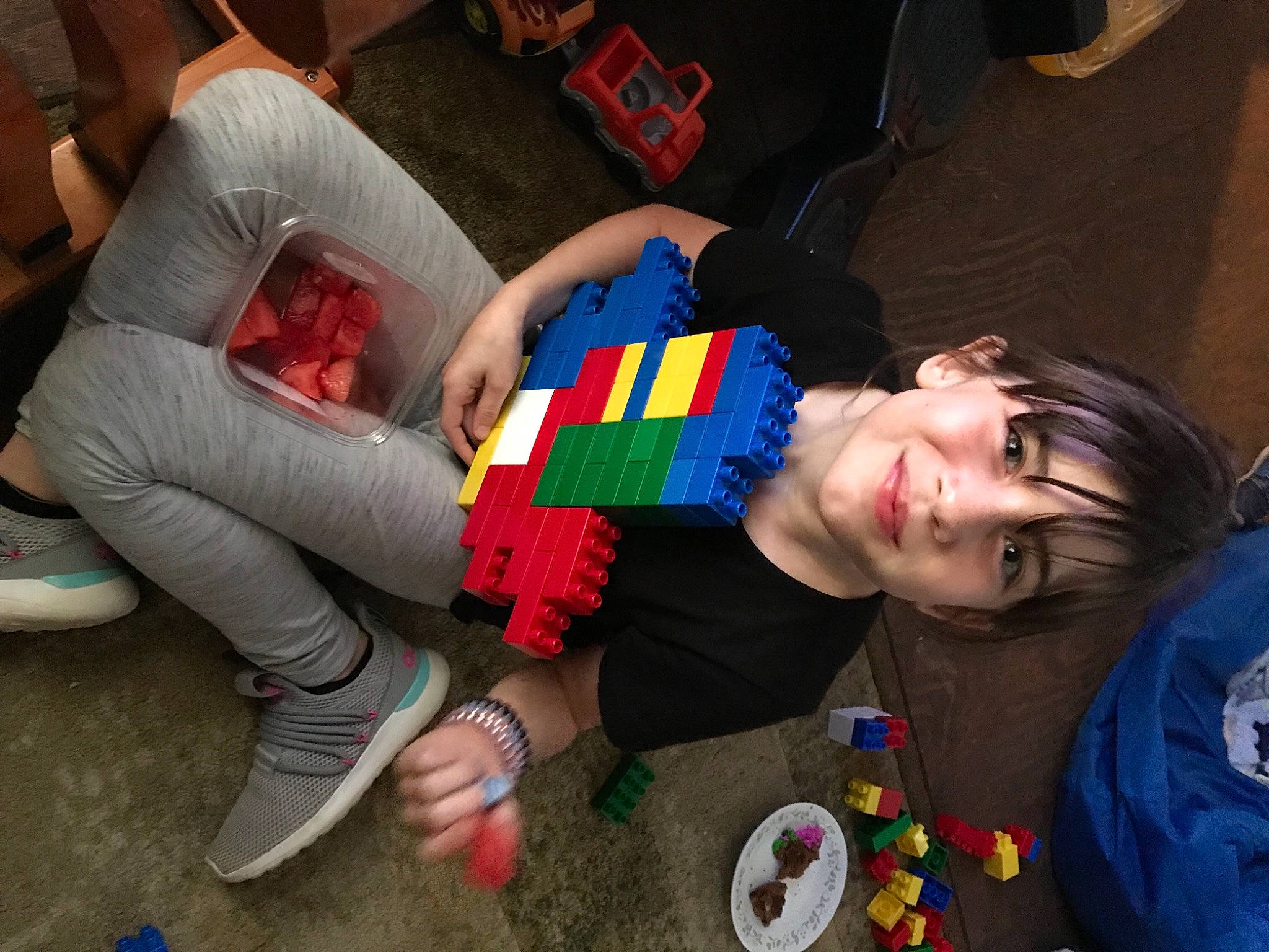 Makenzie is registered to the contest to win money with this photo: child, comfort, couch, event, fun, happy, human_leg, joy, knee, lap, leisure, nail, pattern, person, play, recreation, shoe, sitting, smile, t_shirt