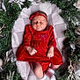 Solana joined the competition — help win amazing prizes! baby, infant, red_dress, headband, christmas_wreath, blanket, holiday, ornaments, silver, greenery, festive, cozy, sleeping, cute, small_socks, decor, celebration, seasonal, portrait, indoors