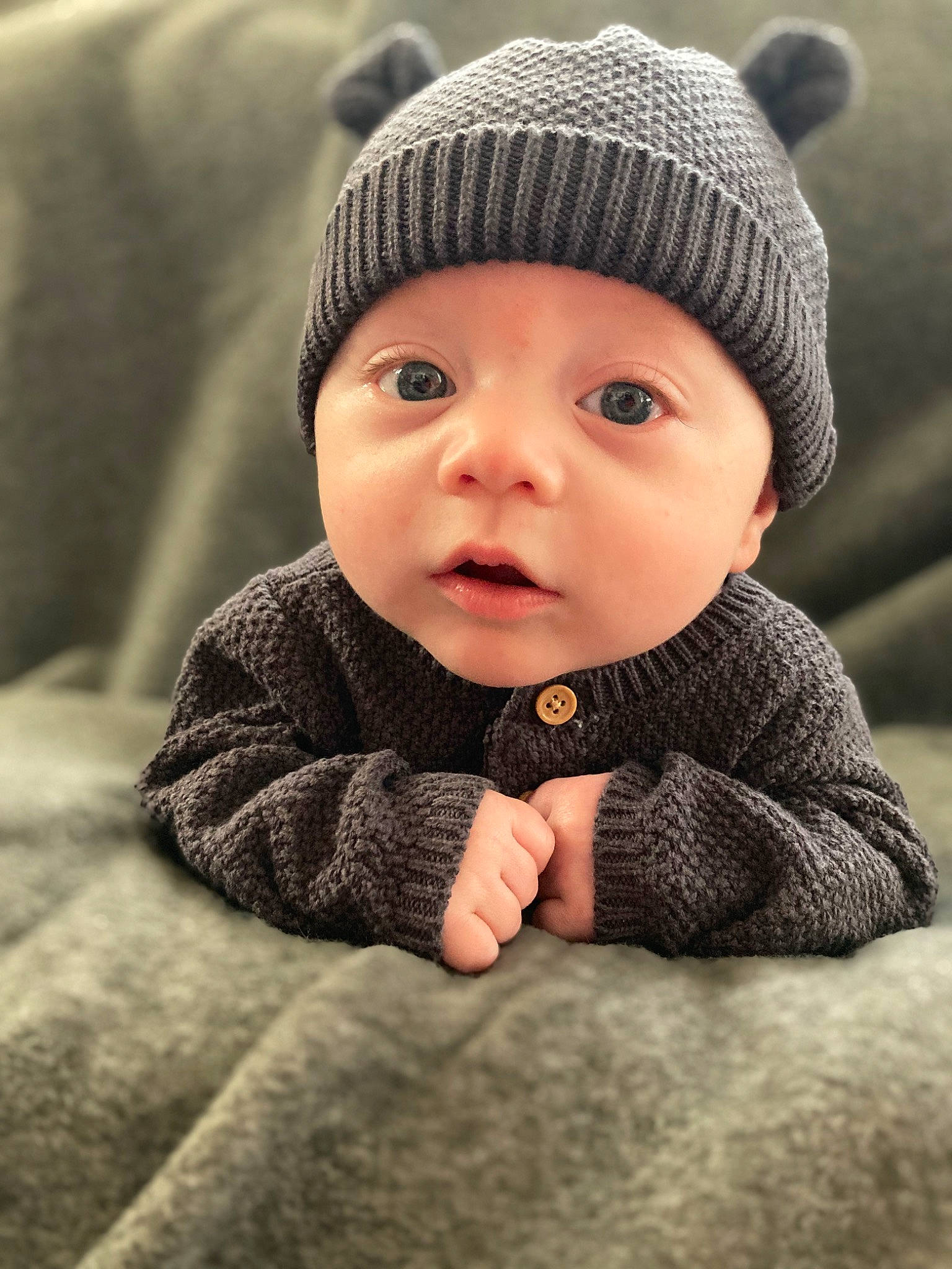 Aurelius joined the competition — help win amazing prizes! baby, baby_toddler_clothing, cap, cheek, child, comfort, eye, flash_photography, grey, happy, headgear, headwear, knit_cap, lip, monochrome_photography, person, sitting, skin, sleeve, toddler