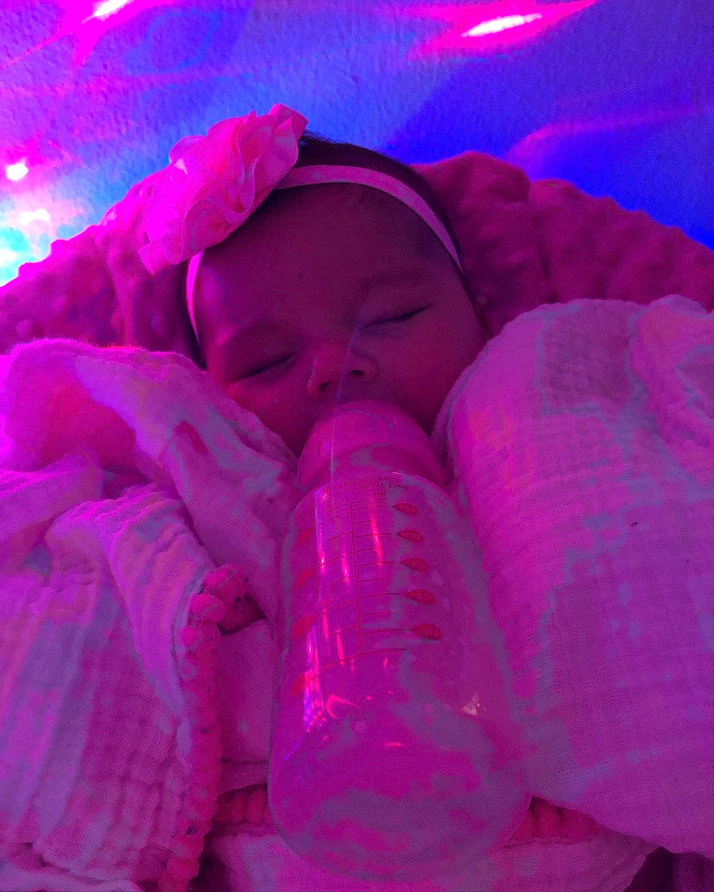 Aaliyah is registered to the contest to win money with this photo: baby, carmine, child, comfort, electric_blue, entertainment, event, fun, holiday, light, magenta, nail, person, pink, plant, plastic_bottle, purple, thumb, toddler, under_exposed