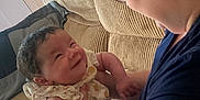 Xophia is registered to the contest to win money with this photo: adult, arm, baby, clothing, corduroy, couch, cute, face, furniture, glasses, happy, holding, human, indoor, infant, interaction, joyful, love, person, smile