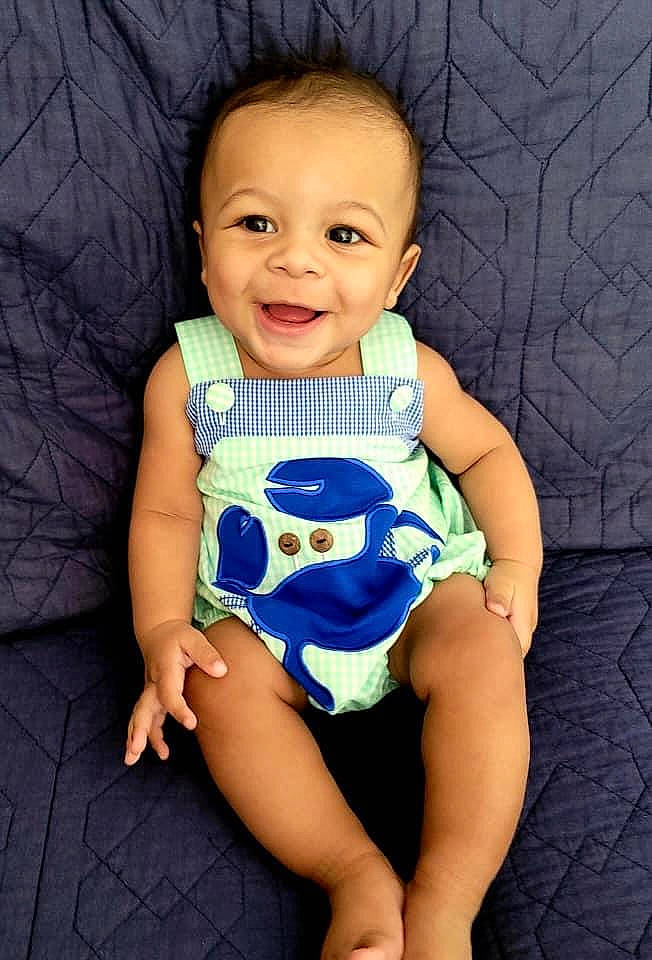 Keelan joined the competition — help win amazing prizes! azure, baby, baby_toddler_clothing, cheek, electric_blue, eye, face, finger, happy, head, human_leg, infant_bodysuit, iris, joy, pattern, person, skin, sleeve, smile, thigh
