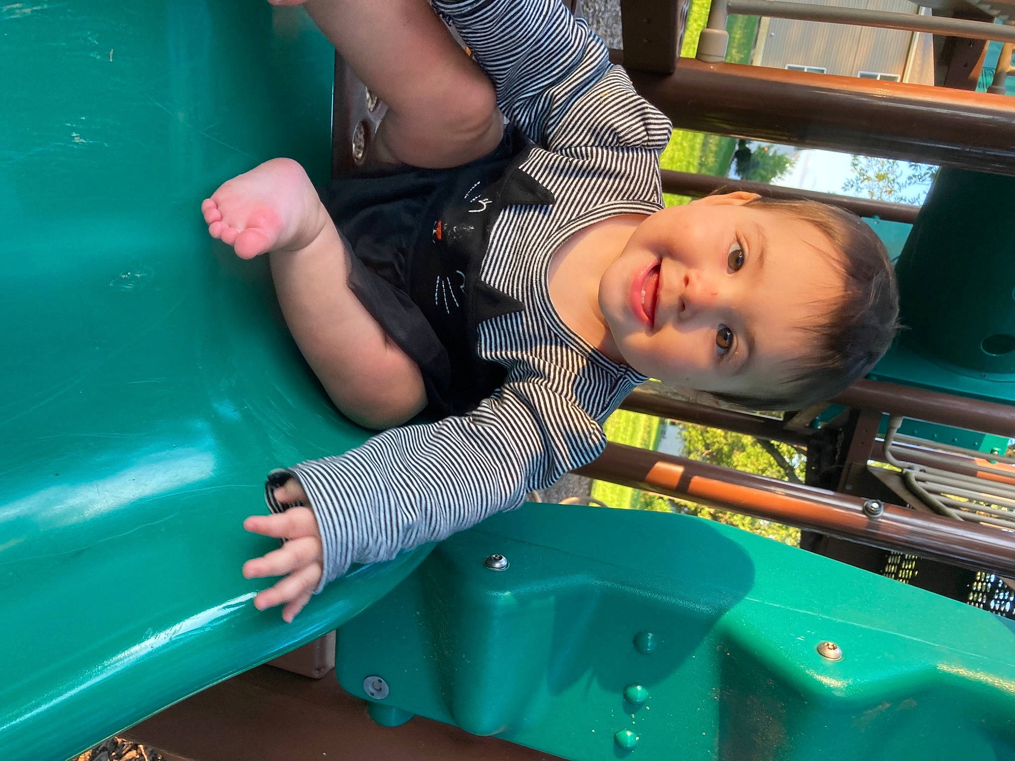 Aliyah-maria is registered to the contest to win money with this photo: arm, baby, baby_toddler_clothing, child, chute, facial_expression, fun, green, hand, happy, joy, leisure, person, play, recreation, sitting, skin, smile, snapshot, t_shirt