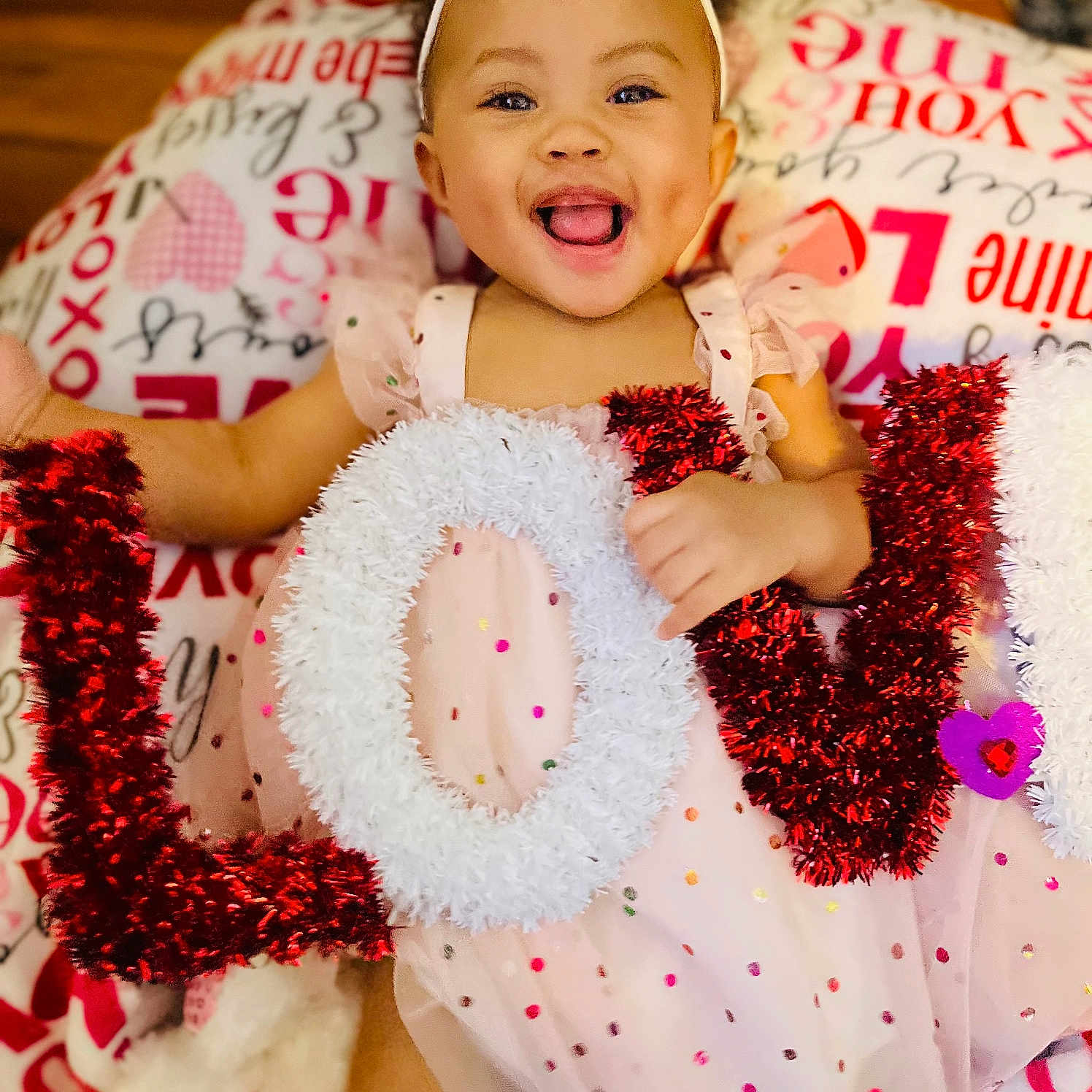 Amaya joined the competition — help win amazing prizes! accessories, baby, bodypart, clothing, couch, dress, face, furniture, happy, head, homedecor, jewelry, laughing, mouth, necklace, person, photography, portrait, smile, teeth