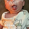 baby, cartoon_bears, child, closeup, cute, expression, face, head, humor, indoors, infant, lying_down, morning, onesie, portrait, skin, sleepwear, soft_light, timestamp, tongue_out