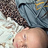 Waylon joined the competition — help win amazing prizes! animal_print, baby, blanket, child, closeup, comfort, cozy, expression, face, head, hoodie, indoor, infant, leopard_print, onesie, person, portrait, resting, sleepy, soft