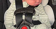 Waylon is registered to the contest to win money with this photo: baby, newborn, car_seat, sleeping, infant, child, onesie, stripes, feet, toes, safety_harness, snugride_lite_lx, head_support, soft_padding, indoors, peaceful, cute, resting, clothing, person