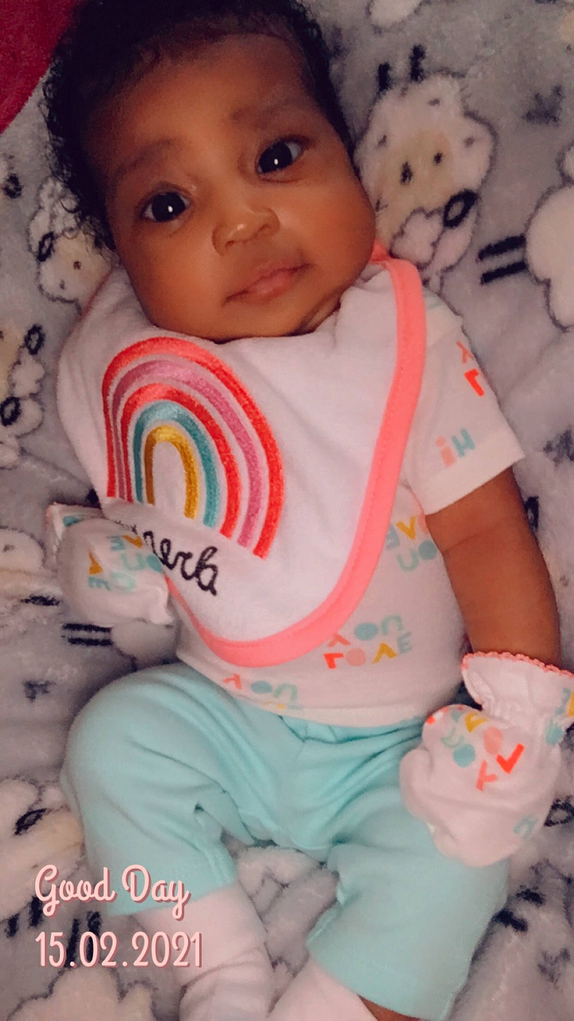 Yomi is registered to the contest to win money with this photo: baby, baby_toddler_clothing, blue, cheek, chin, eye, face, facial_expression, green, head, human, lip, mouth, nose, organ, person, product, skin, sleeve, textile