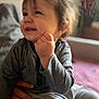 Gabriel a rejoint le concours — aidez-le/la à gagner de superbes lots ! toddler, child, smiling, indoor, person, hand, clothing, gray_shirt, blurred_background, happy, portrait, sitting, hair, face, candid, cozy, family, support, baby, expression