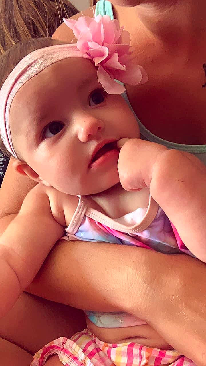 Kylar is registered to the contest to win money with this photo: baby, cheek, child, close_up, finger, hand, lip, mouth, nose, person, pink, skin, thumb, toddler, undergarment