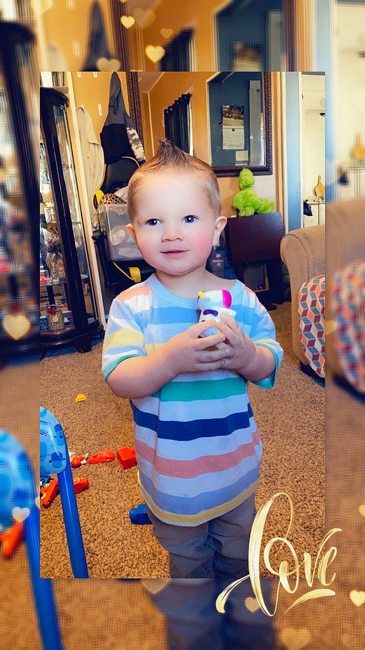 Zayden joined the competition — help win amazing prizes! baby, blue, child, couch, electric_blue, event, flooring, fun, happy, holiday, leisure, person, play, room, shelf, sitting, smile, t_shirt, toddler, toy