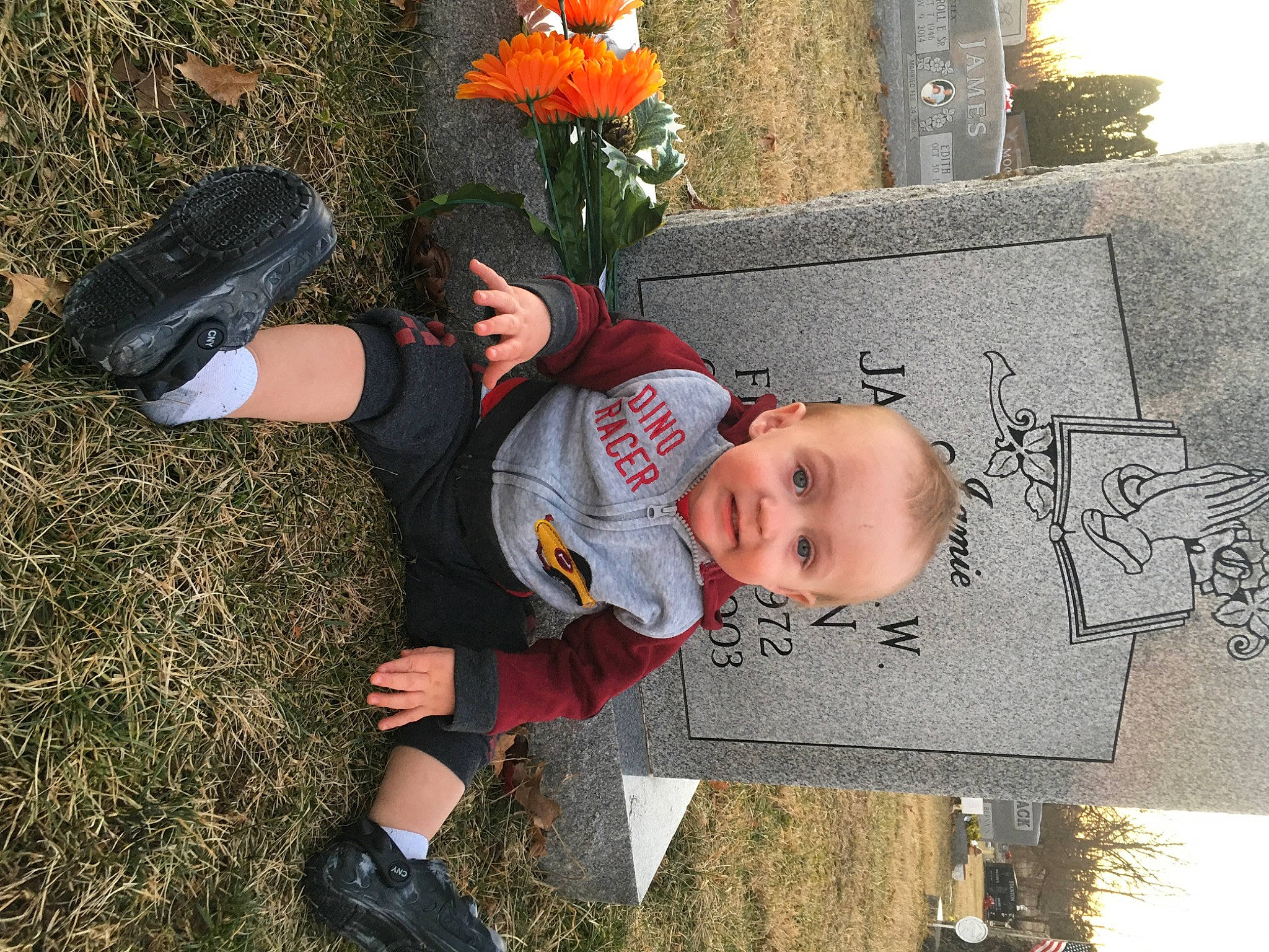 Lyric is registered to the contest to win money with this photo: baby, baby_toddler_clothing, boot, child, flower, fun, grass, happy, hat, lawn_ornament, people_in_nature, person, plant, sitting, smile, sneakers, soil, t_shirt, toddler, tree