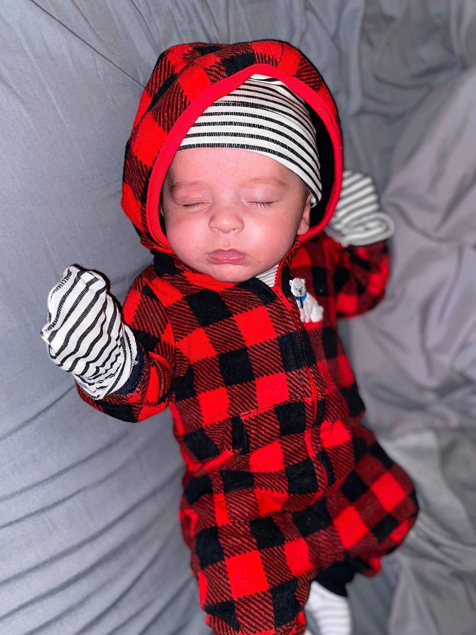 Kashton joined the competition — help win amazing prizes! baby, baby_toddler_clothing, cap, carmine, child, collar, design, fashion_accessory, headgear, headwear, hood, one_piece_garment, outerwear, pattern, person, plaid, red, sleeve, tartan, textile