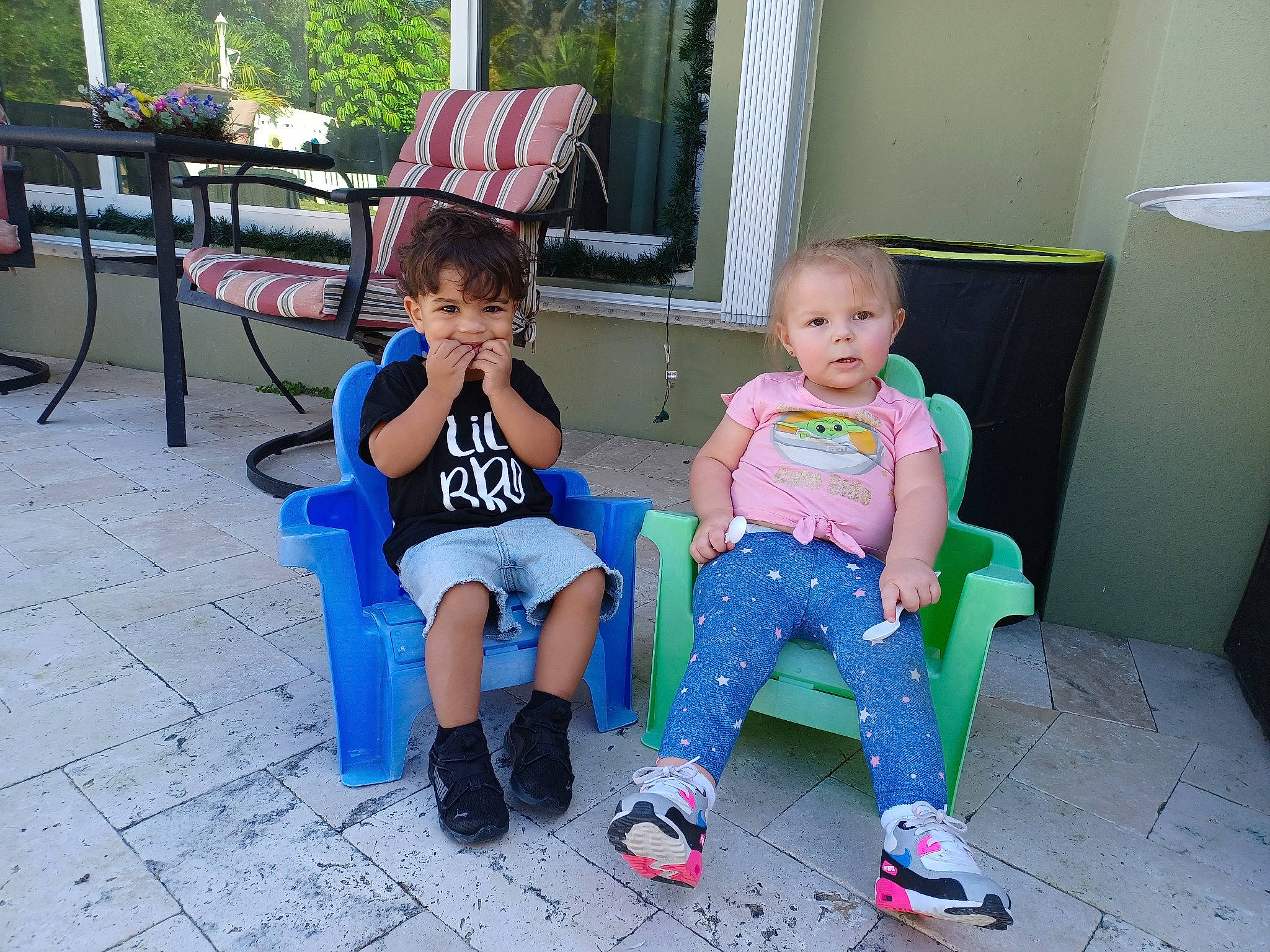 Makenzy joined the competition — help win amazing prizes! baby_toddler_clothing, chair, child, event, flooring, fun, furniture, grass, happy, lap, leisure, outdoor_furniture, person, play, public_space, shoe, shorts, sitting, sneakers, toddler